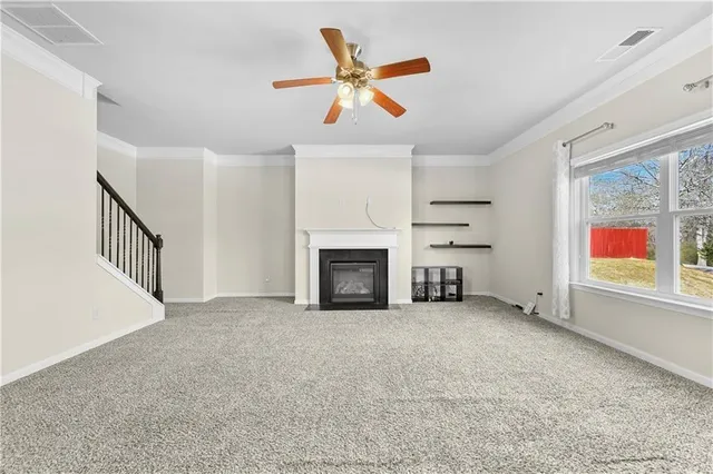 a view of a kitchen with a sink and a fireplace