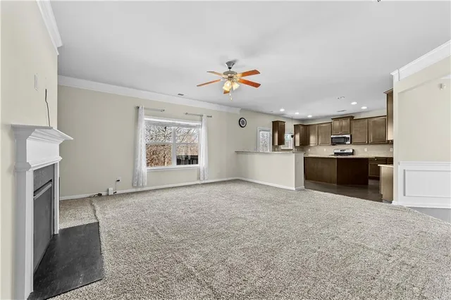 a view of a kitchen with a sink and cabinet flat screen tv