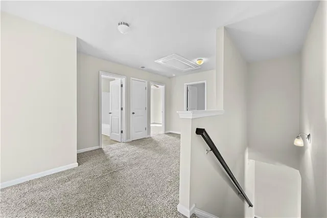 an empty room with closet and a chandelier fan