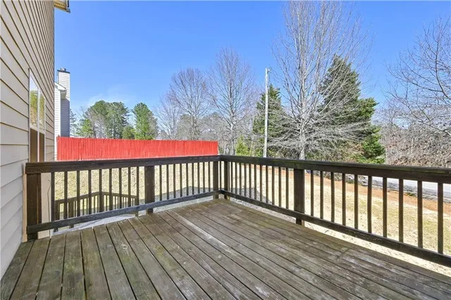 a view of a balcony with wooden floor