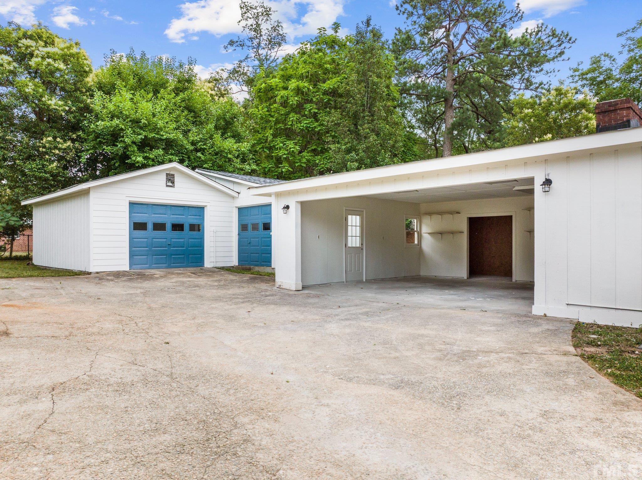 801 Friar Tuck Road Raleigh, NC 27610 - Photo 11 of 24 front view of a house with a yard and garage