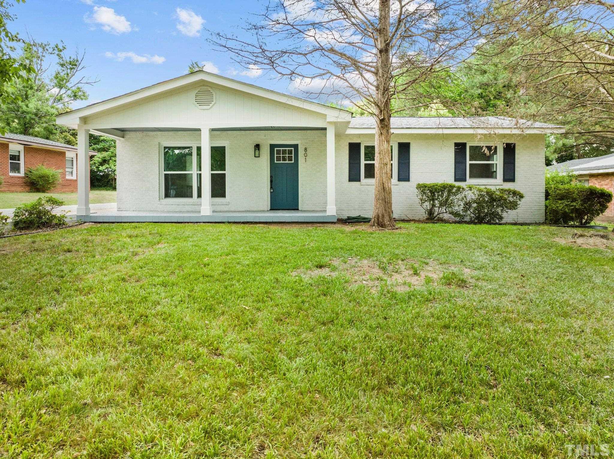 801 Friar Tuck Road Raleigh, NC 27610 - Photo 2 of 24 front view of a house with a yard