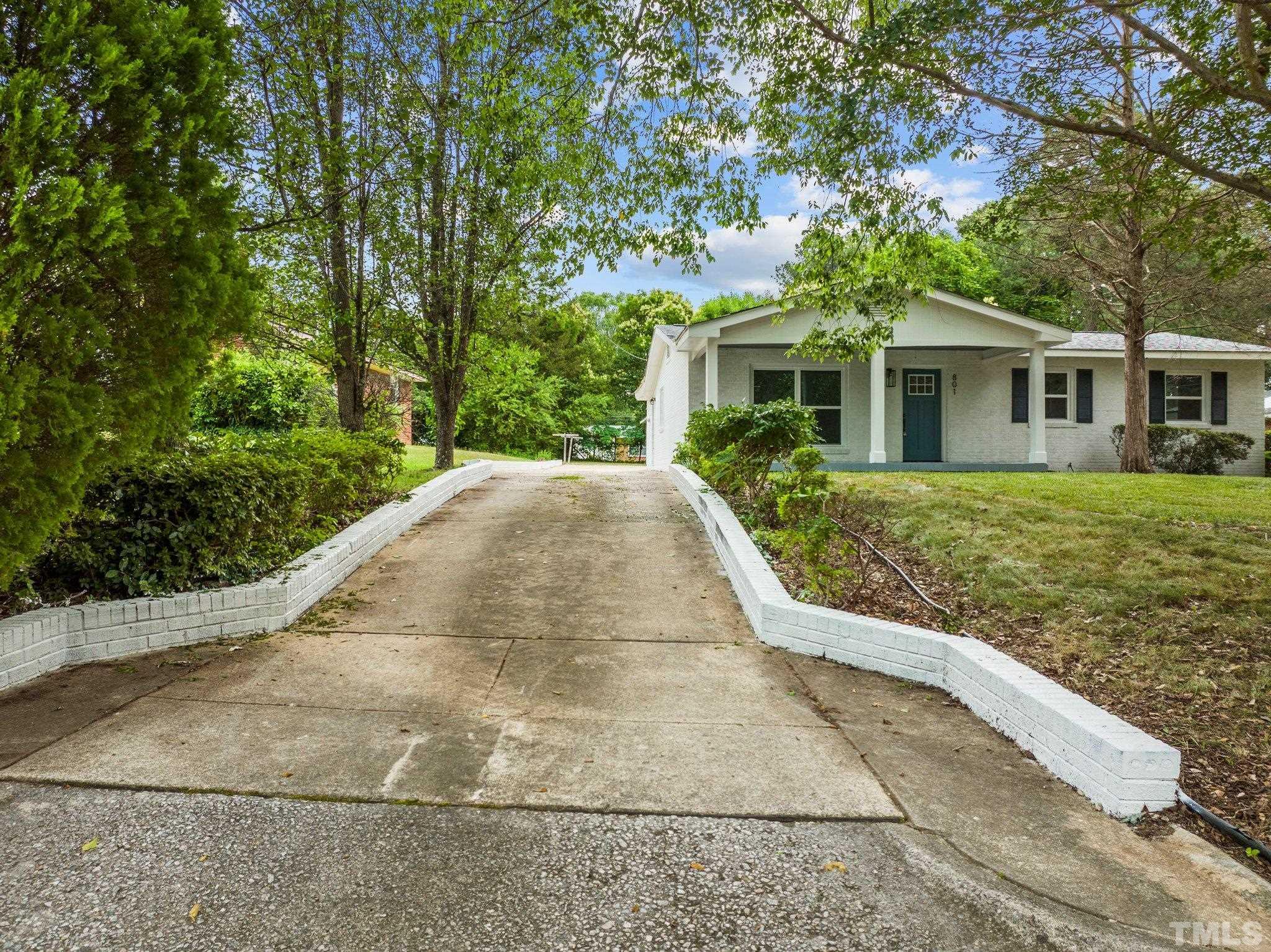 801 Friar Tuck Road Raleigh, NC 27610 - Photo 5 of 24 a view of a house with a yard