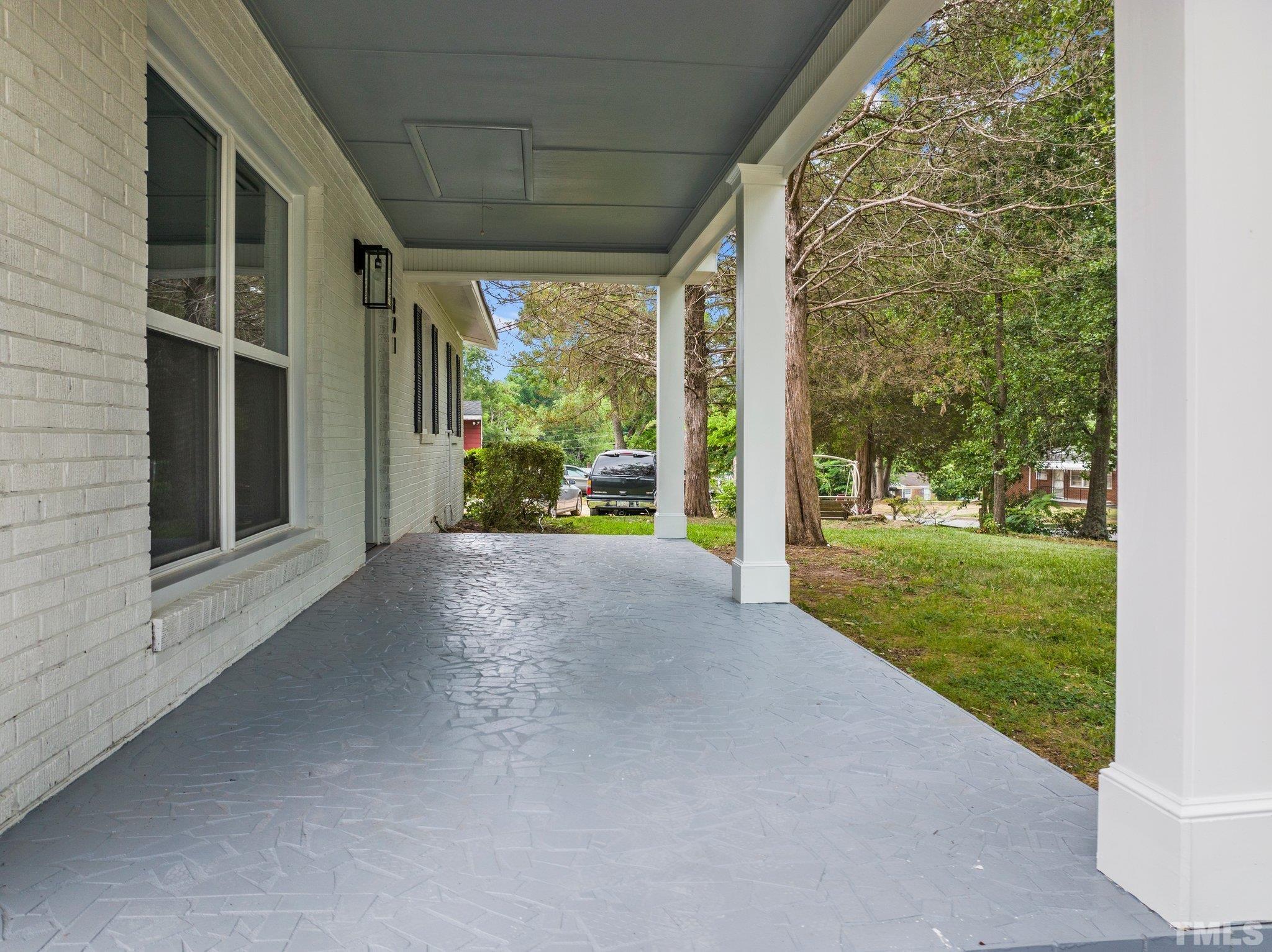 801 Friar Tuck Road Raleigh, NC 27610 - Photo 6 of 24 a view of a house with backyard and porch