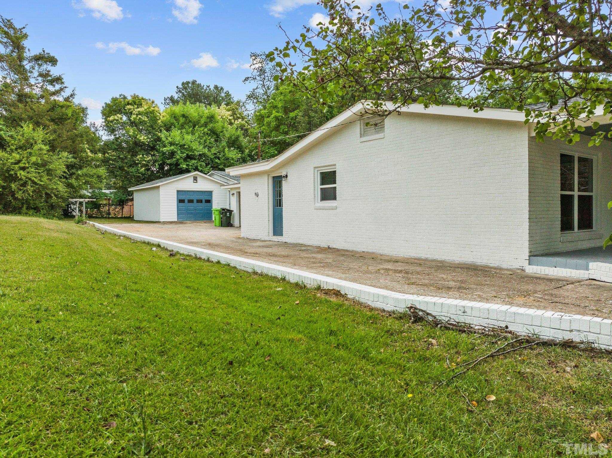 801 Friar Tuck Road Raleigh, NC 27610 - Photo 7 of 24 a house with a yard