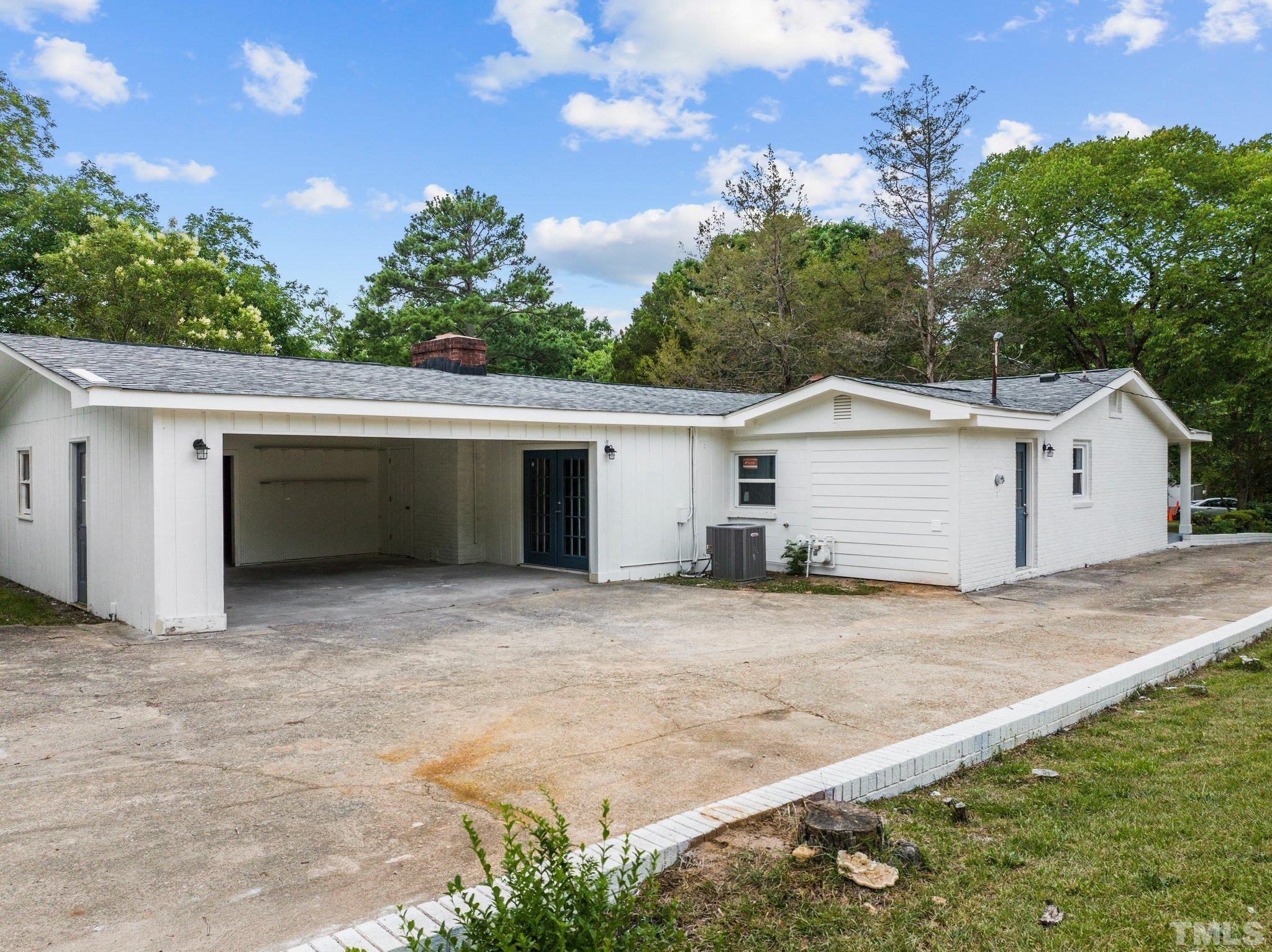 801 Friar Tuck Road Raleigh, NC 27610 - Photo 8 of 24 a view of a house with a garage