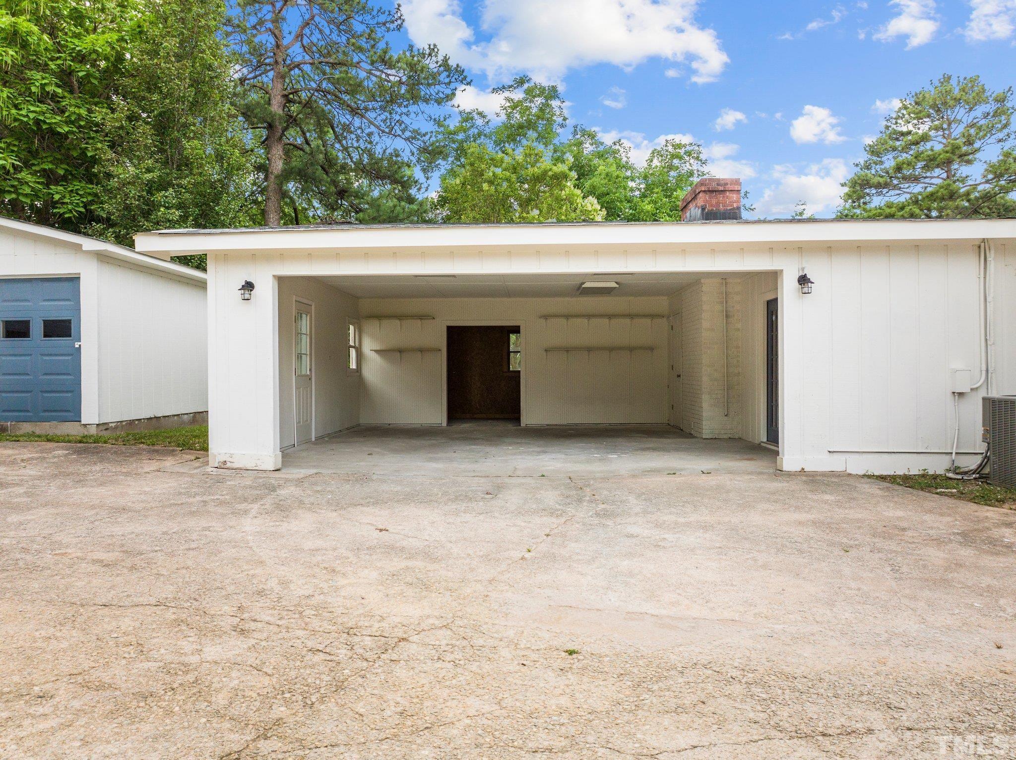 801 Friar Tuck Road Raleigh, NC 27610 - Photo 10 of 24 a view of garage with tree