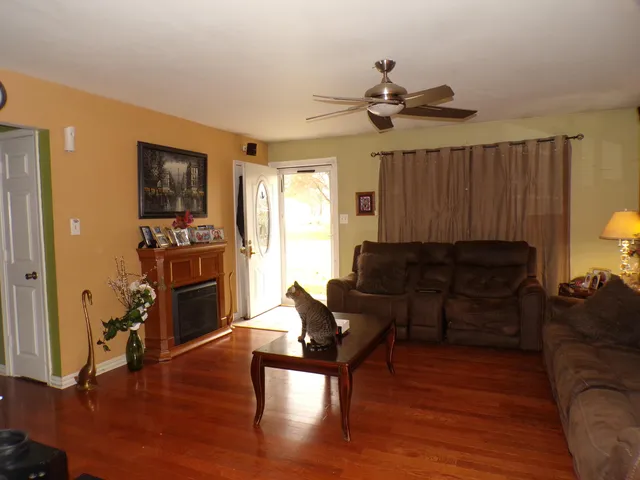 a view of living room with furniture and floor to ceiling window