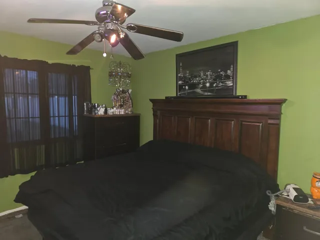 a bedroom with furniture and window