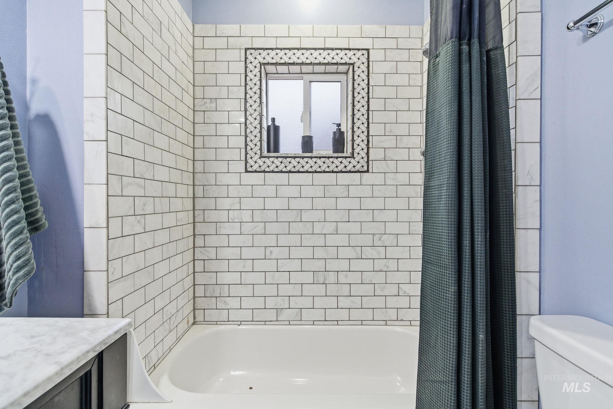 2103 West Bannock Street Boise, ID 83702 - Photo 20 of 49 Bathroom with shower / tub combo with curtain and vanity
