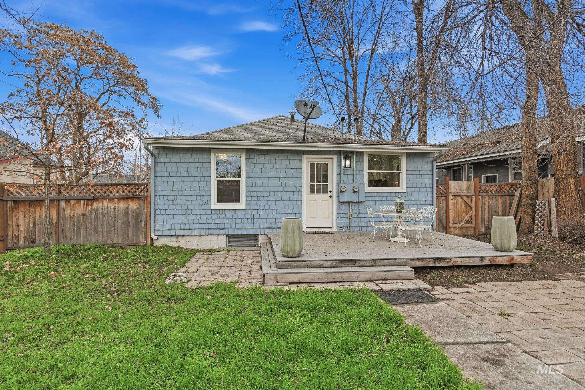 2103 West Bannock Street Boise, ID 83702 - Photo 36 of 49 Back of property with a fenced backyard and a deck