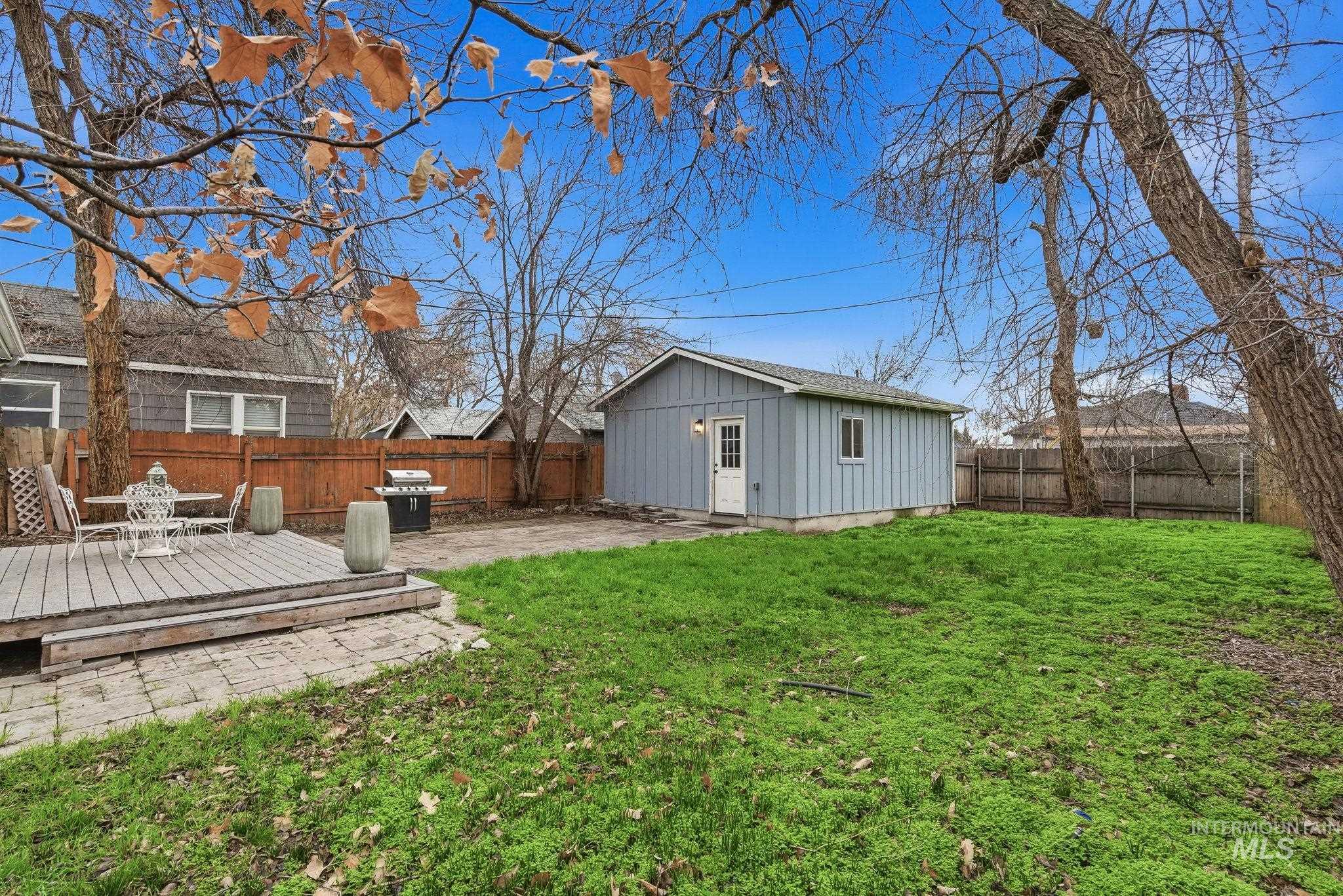 2103 West Bannock Street Boise, ID 83702 - Photo 37 of 49 Fenced backyard with an outbuilding, a patio, and a deck