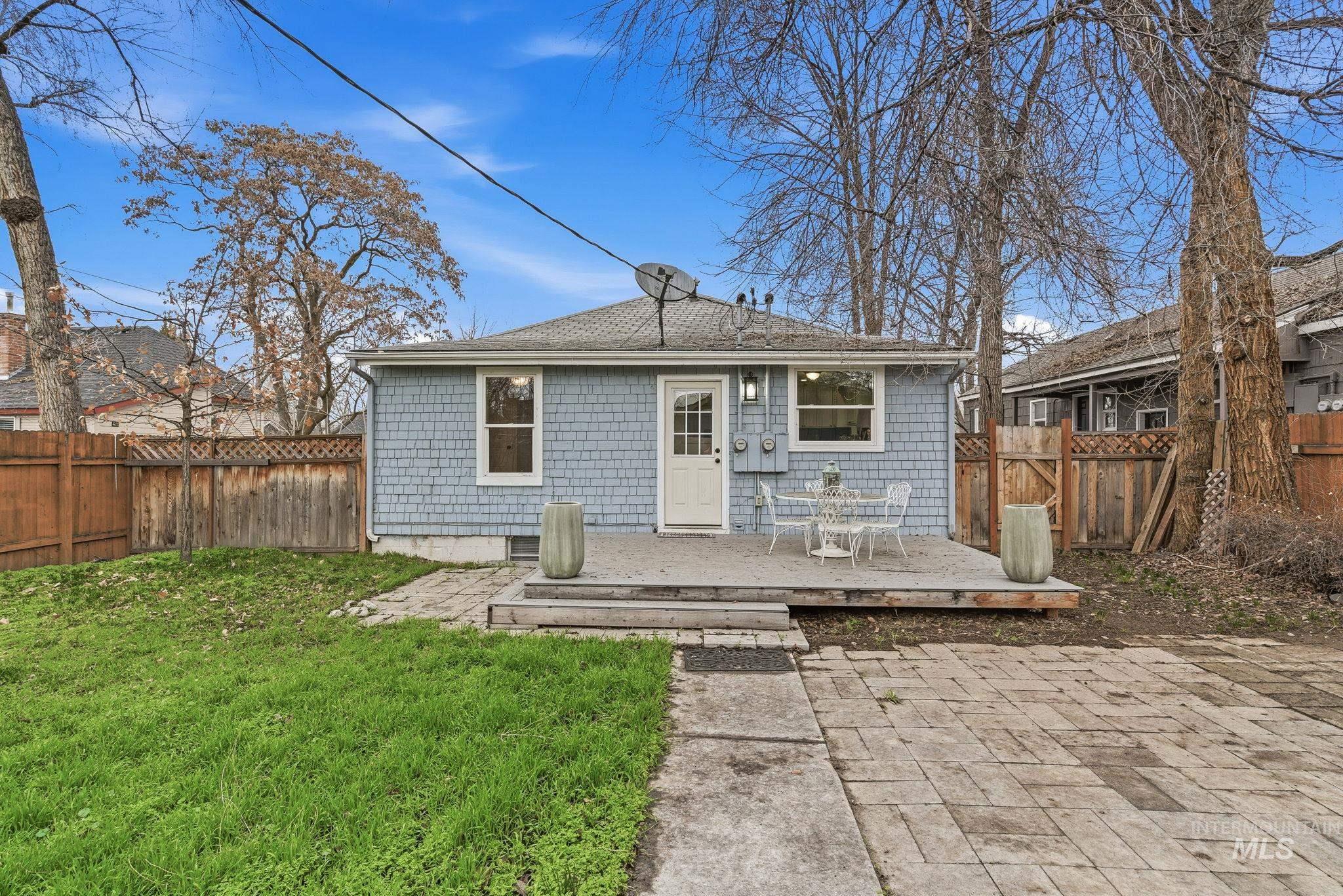 2103 West Bannock Street Boise, ID 83702 - Photo 39 of 49 Rear view of property with a fenced backyard, a deck, and roof with shingles