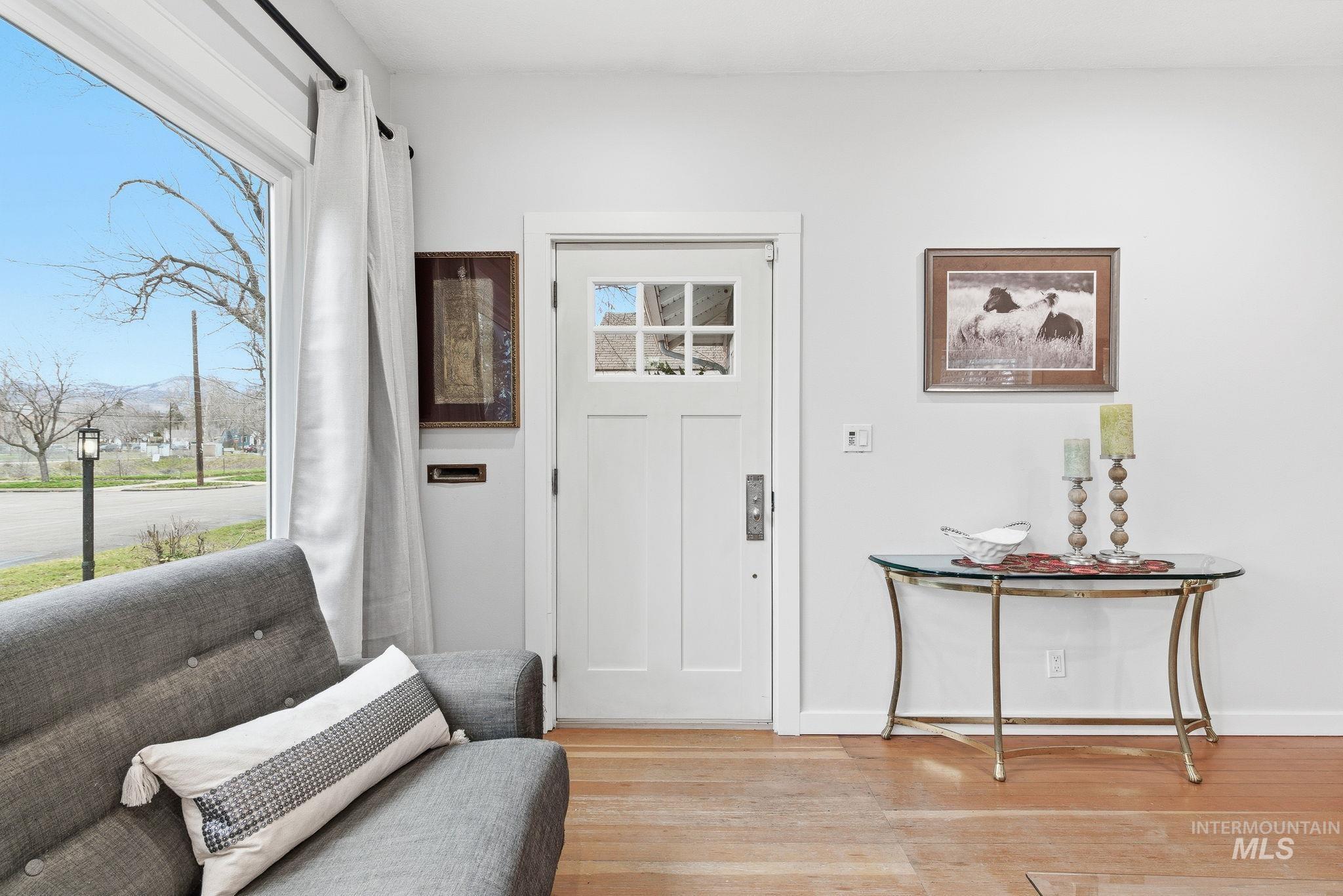 2103 West Bannock Street Boise, ID 83702 - Photo 4 of 49 Entryway featuring baseboards and wood finished floors