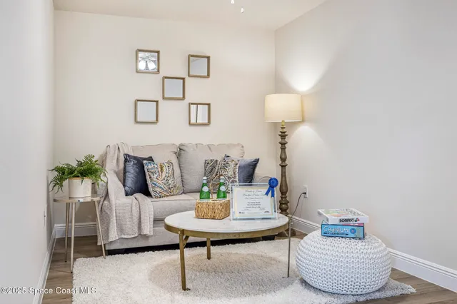 a living room with furniture and a table