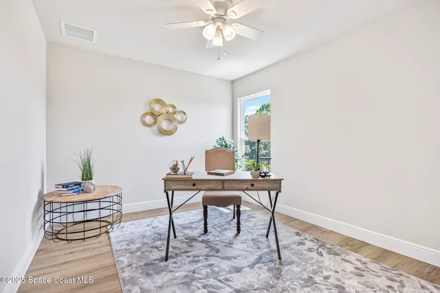 a workspace with furniture and window