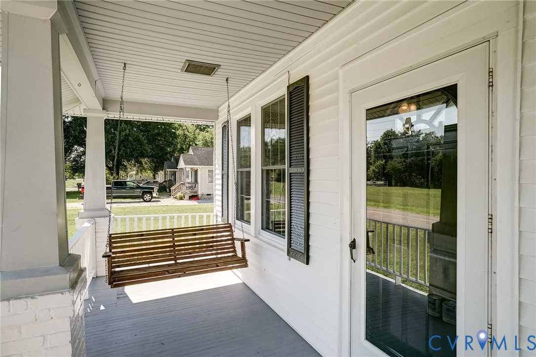 10024 Washington Road Glen Allen, VA 23060 - Photo 12 of 47 Covered porch with white siding, white railing, an