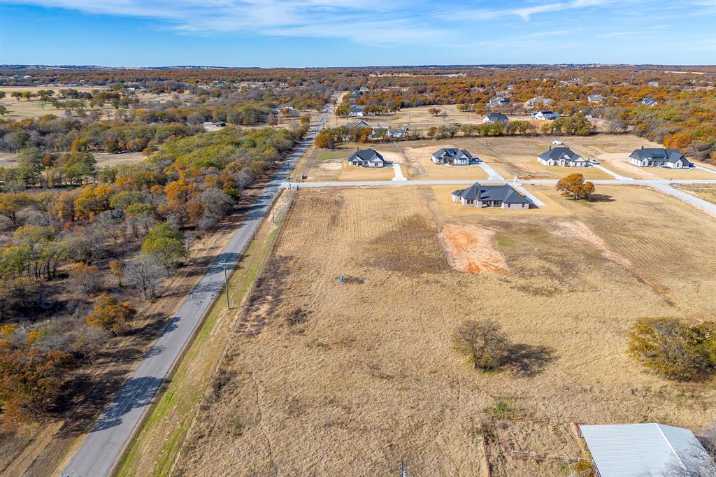 100 Prairie Winds Drive Poolville, TX 76487 - Photo 4 of 9 an aerial view of a house with a yard