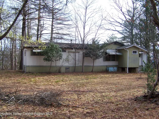 a house with trees in front of it