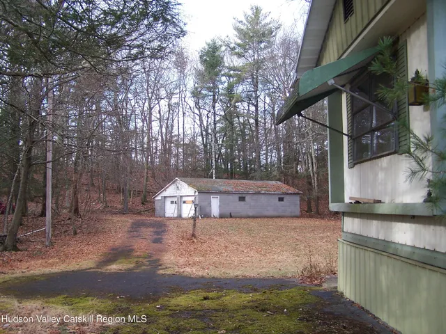 a view of a back yard of the house