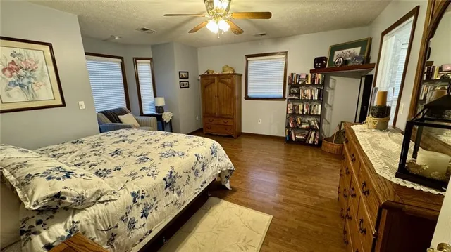 a bathroom with a double vanity sink a mirror and a shower