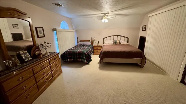 an aerial view of a house with outdoor space and street view