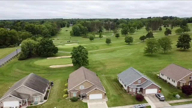 a view of a water pond with green space