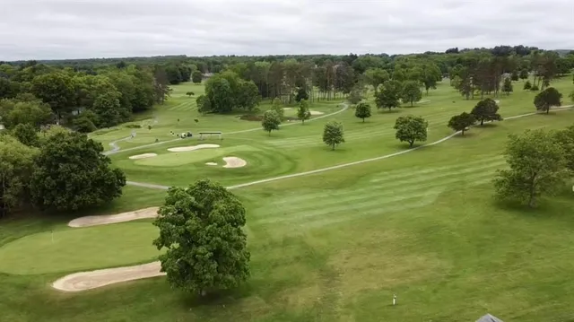 a view of a golf course with a lake