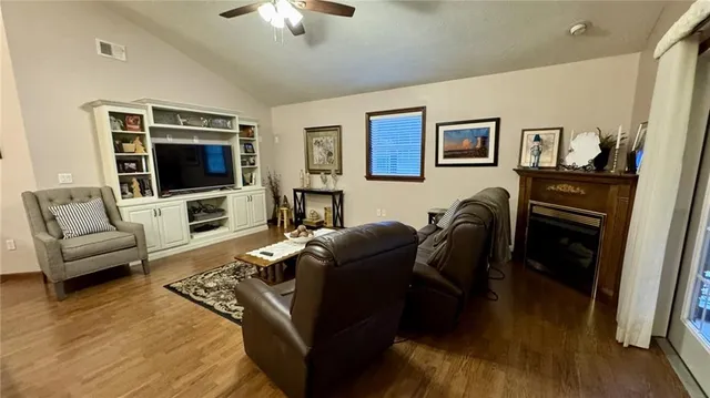 a living room with furniture and a flat screen tv