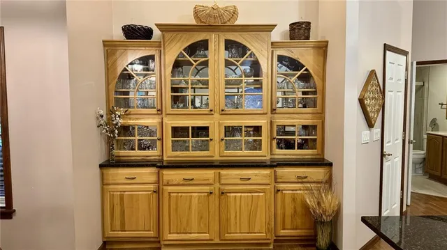 a kitchen with stainless steel appliances granite countertop a stove and cabinets