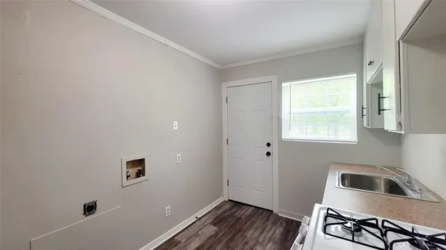 a kitchen with a sink and a window
