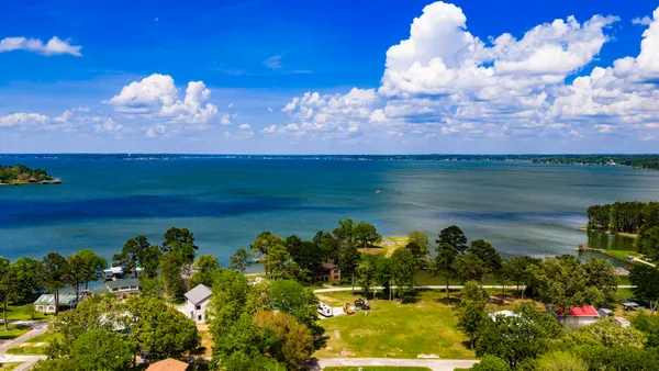a view of a lake and a yard
