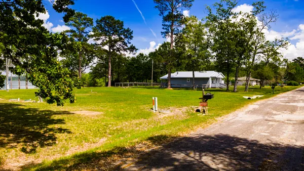 a view of a swimming pool with a yard