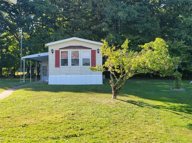 a front view of a house with swimming pool