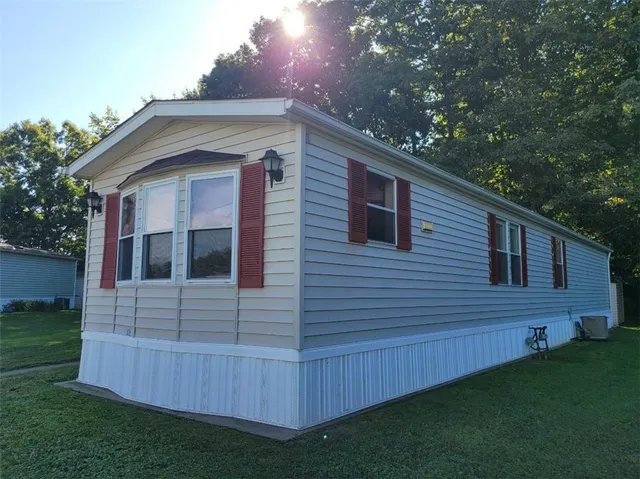 a view of front of house with a yard