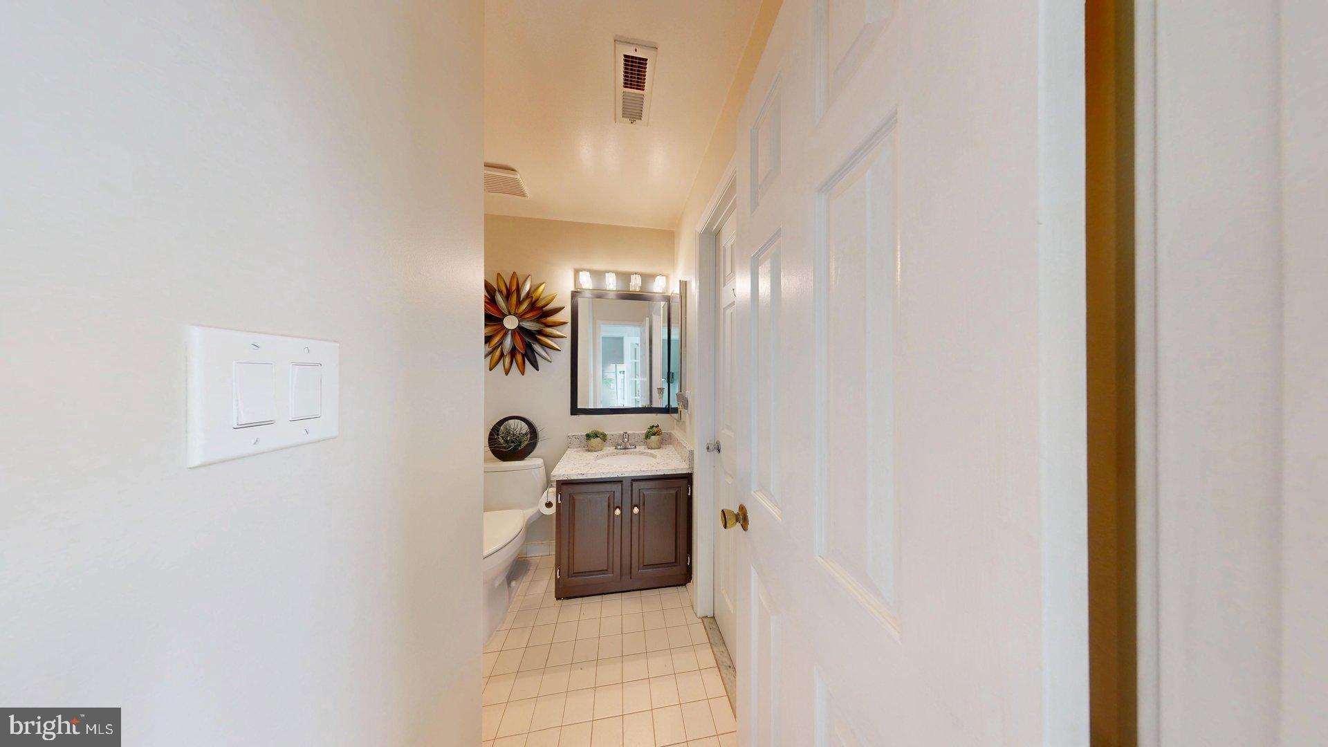 11901 Rustic Farm Court Germantown, MD 20874 - Photo 29 of 134 Inviting hallway to a serene bathroom.
