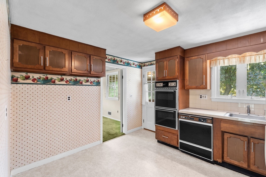 348 Belknap Road Framingham, MA 01701 - Photo 10 of 35 a kitchen with stainless steel appliances a stove and a refrigerator