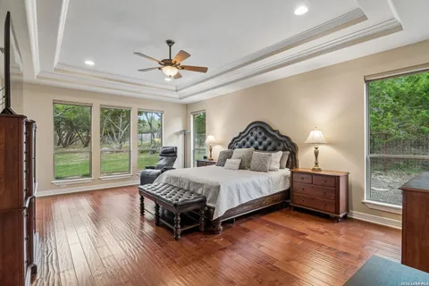 a bedroom with a bed lamp and window