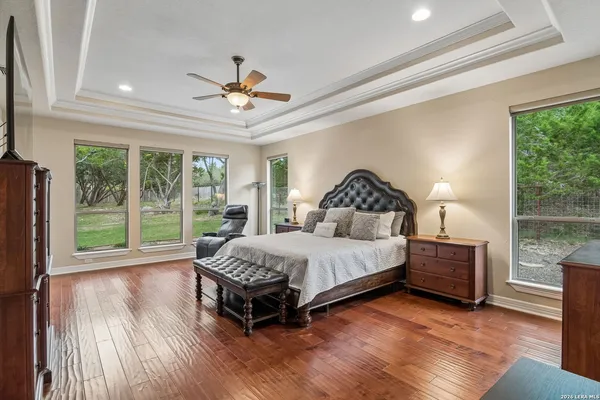 a bedroom with a bed lamp and window