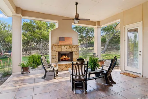 a house view with a seating space and a potted plant