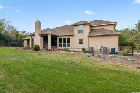 a front view of house with yard and seating area