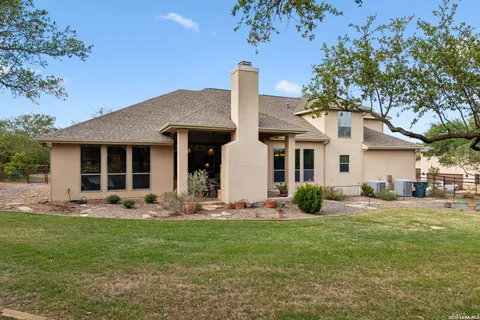 a front view of house with yard outdoor seating and green space
