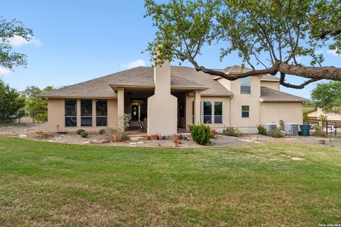 a front view of a house with a yard and porch