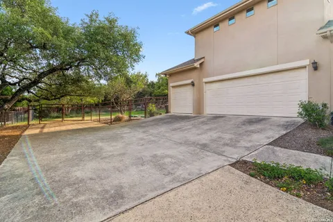 a view of backyard with large trees