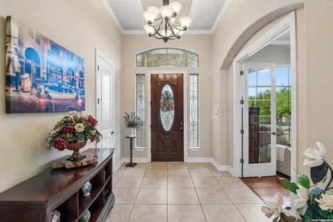 a view of livingroom with furniture and a chandelier