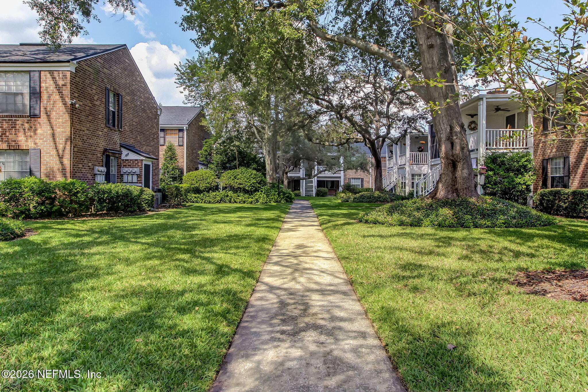 4358 Timuquana Road, Unit 134 Jacksonville, FL 32210 - Photo 24 of 31 a pathway in front of house with a yard