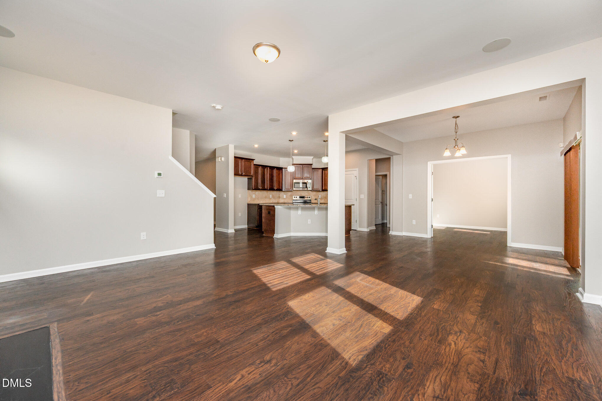 18 Dover Ridge Court Chapel Hill, NC 27517 - Photo 14 of 40 a view of a living hall with wooden floor and a kitchen