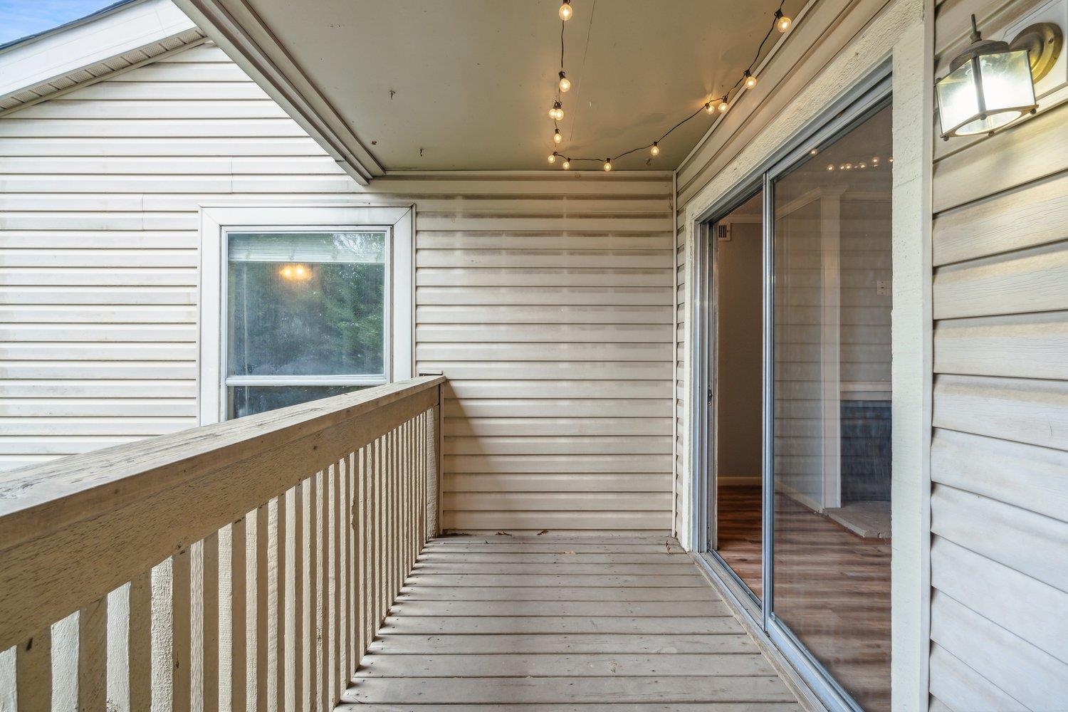 1701 Ridge Oak Place, Unit 4 Memphis, TN 38120 - Photo 13 of 21 a view of a balcony with wooden floor and stairs