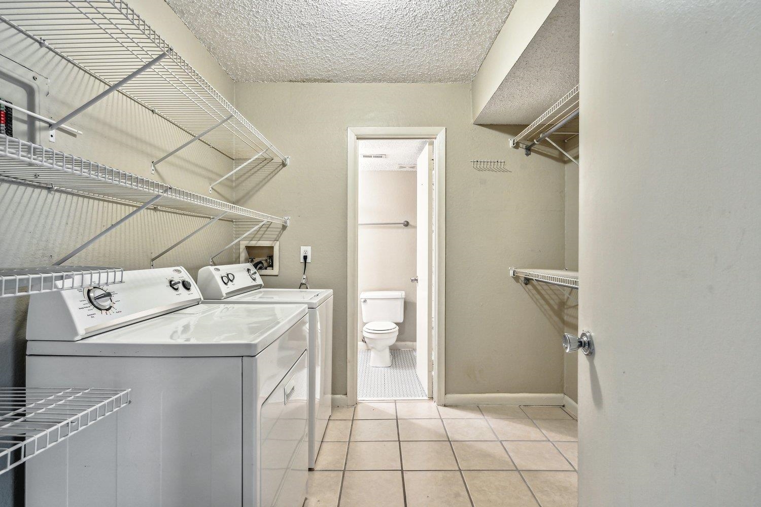 1701 Ridge Oak Place, Unit 4 Memphis, TN 38120 - Photo 14 of 21 a utility room with dryer and washer