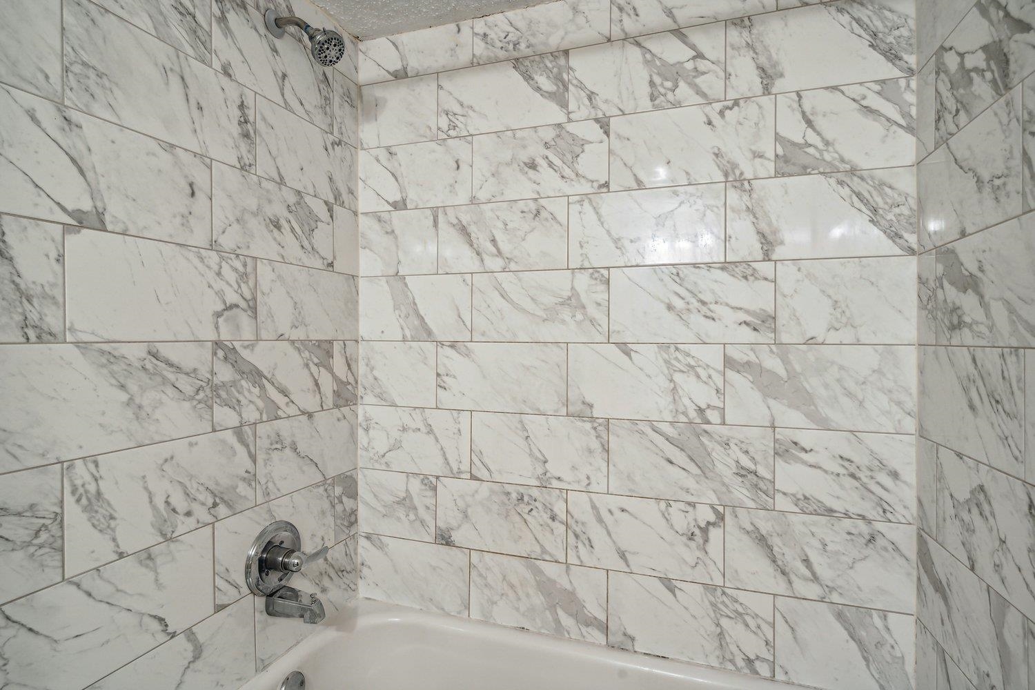 1701 Ridge Oak Place, Unit 4 Memphis, TN 38120 - Photo 16 of 21 a bathroom with a bathtub